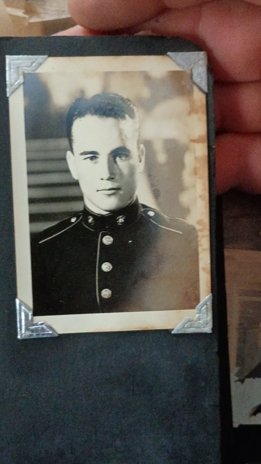 WWII-era US Marine Corps portrait photo in black album with metal corners