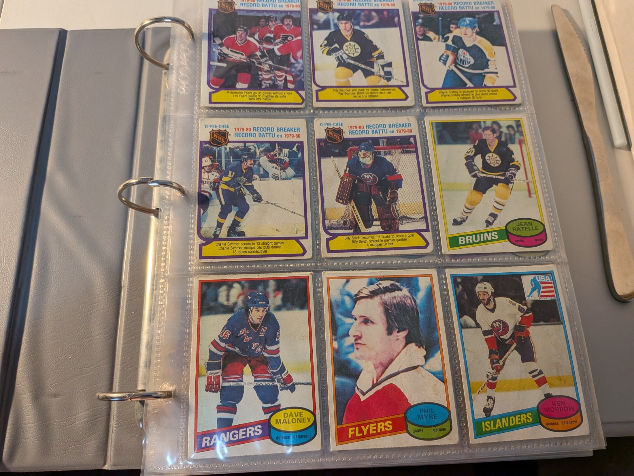 Multiple players — Dave Maloney, Phil Myre, Ken Morrow, Jean Ratelle, plus 1979-80 Record Breaker cards (Philadelphia Flyers, Ray Bourque, Wayne Gretzky, Charlie Simmer, Billy Smith)